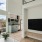 a living room with a tv and a table